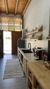 a kitchen with a stove and a counter top at Vila Ramaj in Berat
