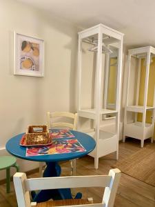 a room with a table and a bunk bed at Apartments Olga in Bled