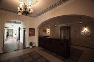 a large lobby with a chandelier and a hallway at Rangmahal Pushkar by DIV HOSPITALITY in Pushkar +67 photos