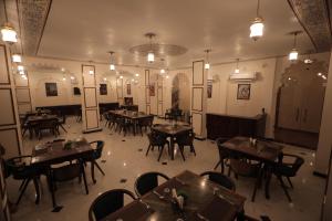 an overhead view of a restaurant with tables and chairs at Rangmahal Pushkar by DIV HOSPITALITY in Pushkar