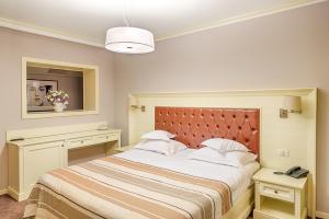 Una cama o camas en una habitación de Nord Hotel