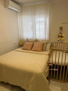a large bed in a bedroom with a window at Casa Quijote in La Herradura +15 photos