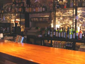 a bar with a bunch of bottles of wine at Posada de Bleto in Ledesma