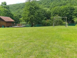 a field with a goal in the middle of a park at Kamp SAN in Zaglavica +1 photo
