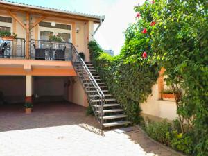 a stairway leading up to a house at Hotel Isabell Győr in Győr