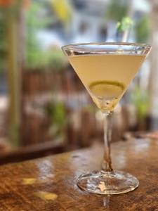 a martini glass sitting on top of a table at Laughing Leopard Trinco in Trincomalee