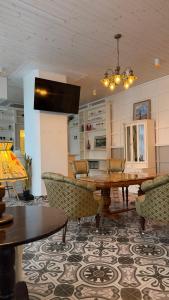 a dining room with a table and chairs at Venezia in Haapsalu