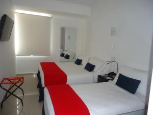 Ένα ή περισσότερα κρεβάτια σε δωμάτιο στο Zalmedina Hotel