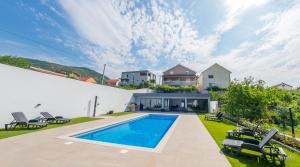 a swimming pool in the backyard of a house at Villa Amor in Mostar +101 photos