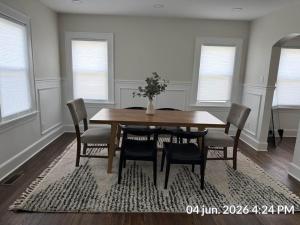 a dining room with a wooden table and chairs at The Signature Stay in Clifton