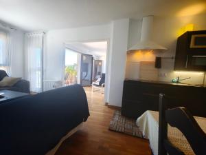 a room with a bed and a living room with a couch at Vistas de Ronda in Ronda +20 photos