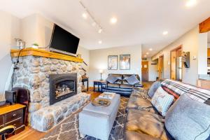a living room with a couch and a fireplace at Mountain View Home in Bartlett