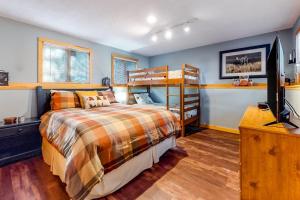 a bedroom with a bed and a television in it at Mountain View Home in Bartlett