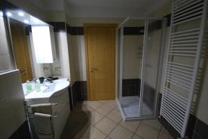 a bathroom with a shower and a sink at Casa Debora in Valdidentro +24 photos