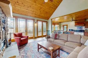 a living room with a couch and a table at Garfield's Grand View in Bethlehem