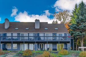 a large house with a balcony and trees at Mountain View Home in Bartlett