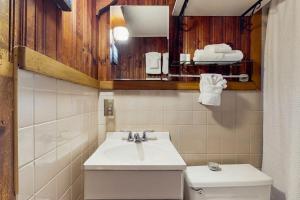 a bathroom with a sink and a toilet at Rustic Rockport Cottage in Rockport +37 photos