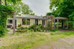 a house with a garden and a pergola at Vintage Rockport Escape in Rockport