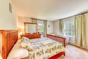 a bedroom with two beds and a large window at Franconia's Far Far Away in Franconia
