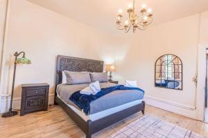a bedroom with a bed and a chandelier at 406 Canyon Rd #1 in Ogden