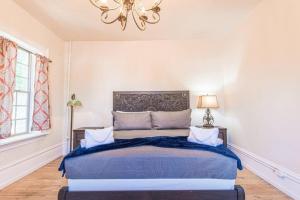 a bedroom with a large bed with a chandelier at 406 Canyon Rd #1 in Ogden