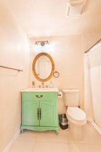 a bathroom with a green cabinet and a toilet at 406 Canyon Rd #2 in Ogden