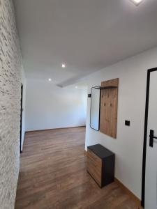 a room with a mirror and a dresser in it at Mazurska przystań 2 in Gąsiorowo Olsztyneckie