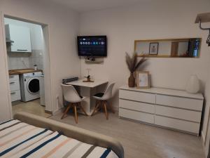 a room with a kitchen with a table and chairs at Ivana Apartment in Rabac