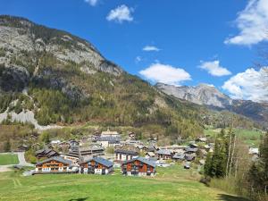a village in a valley with a mountain at Les Chalets d'Offaz - Centre Abondance - Alp'in C in Abondance