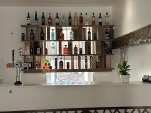 a shelf filled with bottles of alcohol on a wall at Hotel Blackpool in Blackpool