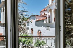 a view of a building from a window at Alkyoni Samos Maisonette in Mytilinioí