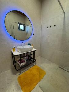a bathroom with a sink and a mirror at Vila KEY-A in Borsh +12 photos