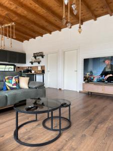 a living room with a couch and a table at Vila KEY-A in Borsh