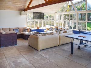 a living room with couches and a flat screen tv at Lily Pad 9 - Uk43919 in Nassington