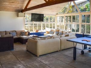 a living room with couches and a flat screen tv at Lily Pad 9 - Uk43919 in Nassington +18 photos