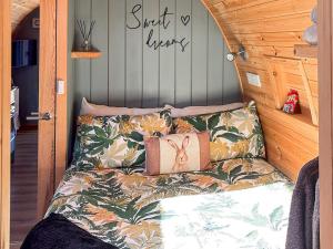 a bed in a tiny house with pillows on it at The Appleton - Ukc9283 in Brompton