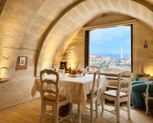 a dining room with a table and a window at Iris Cave Cappadocia in Ortahisar