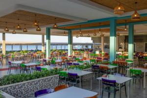 an empty restaurant with tables and chairs at Crystal Waterworld Aqua Collection - Ultimate All Inclusive in Belek
