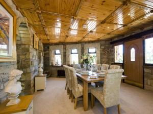 a large dining room with a table and chairs at Tennox Parlour - Ukc3542 in Kilbirnie