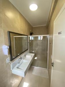 a bathroom with a sink and a shower at Hotel Westphal in Pelotas +133 photos