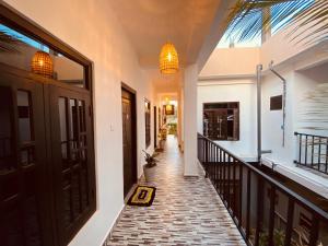 a hallway of a house with a balcony at Casa Moon Trincomalee Beach House in Trincomalee