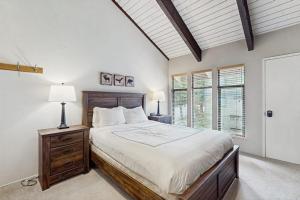a bedroom with a large bed and a window at St. Moritz 13 in Mammoth Lakes +105 photos