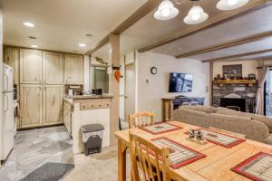a kitchen and living room with a table and a couch at The Summit 5 in Mammoth Lakes