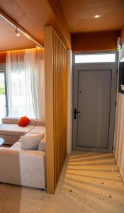 a room with two beds and a sliding door at CASA Terraya in Afantou