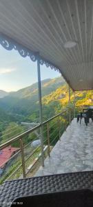 a balcony with a view of the mountains at LEYLİ GABAN VİLLA in Çaykara +4 photos
