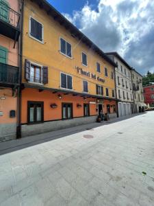a building with a sign that reads i tried my curve at Hotel del Corso in Sestola +9 photos