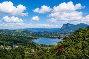 a view of a lake in the mountains at Green Mountain Cabin in Nuwara Eliya
