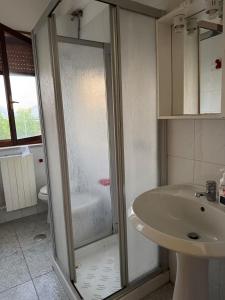 a bathroom with a shower and a sink at Agriturismo Bufaleria in Scanzano +27 photos