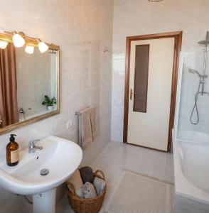a bathroom with a sink and a mirror and a shower at Simohouse Lecce - Executive Suite Apartment 140mq - 2 Bathrooms in Lecce +82 photos