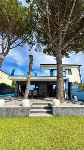 a house with two trees in front of it at Villa Borik in Vrsi